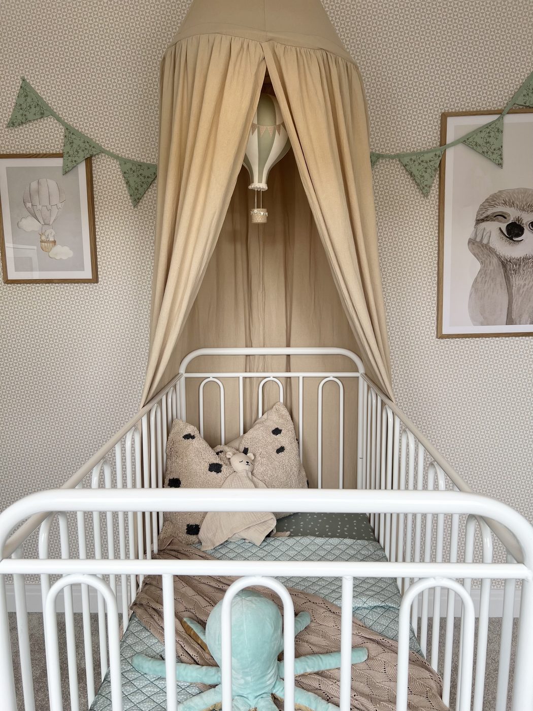 Nursery cot with bunting